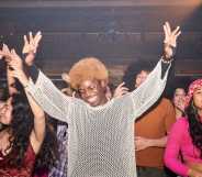 Young people having fun with their arms in the air