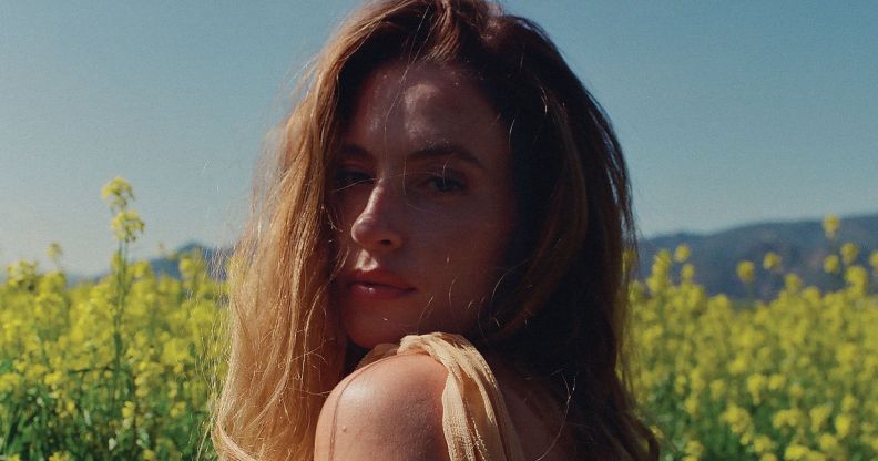 Fletcher poses in a field.