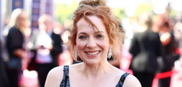 Katherine Parkinson smiles on the red carpet of the BAFTAS in 2025.