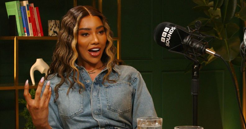 Model and activist Munroe Bergdorf sits by a microphone for a BBC Sounds interview