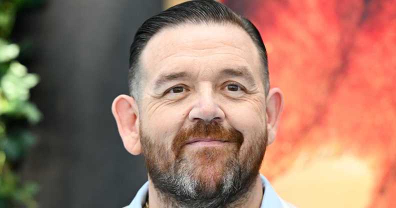 Nick Frost smiling in a blue shirt.