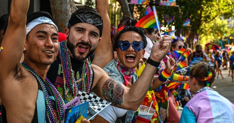 People attend a Pride Parade, in Orlando, Florida on October 15, 2022. (Photo by Giorgio VIERA / AFP) (Photo by GIORGIO VIERA/AFP via Getty Images)