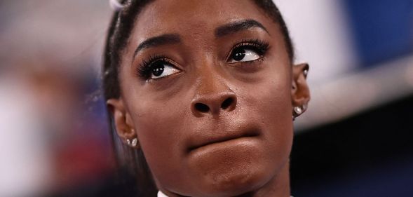 A picture of Simone Biles looking pensive.
