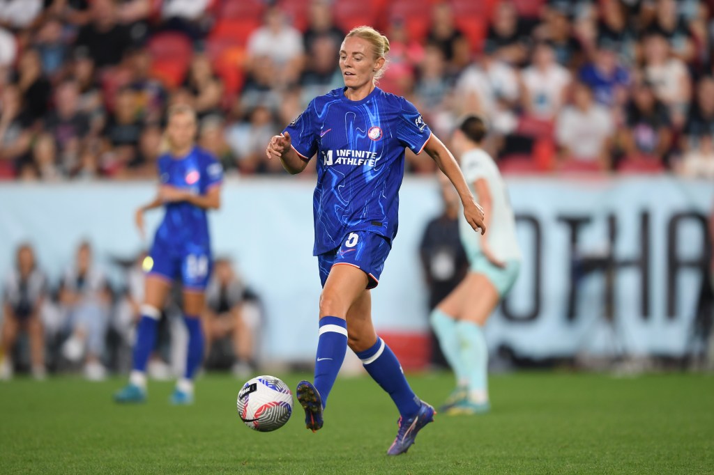Sophie Ingle of Chelsea in a full blue kit dribbling the ball on the pitch