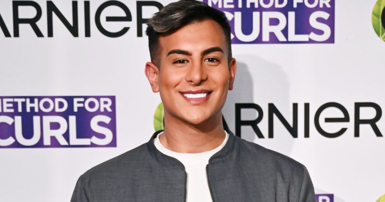 TOWIE star Junaid Ahmed smiles on the red carpet in April 2025.