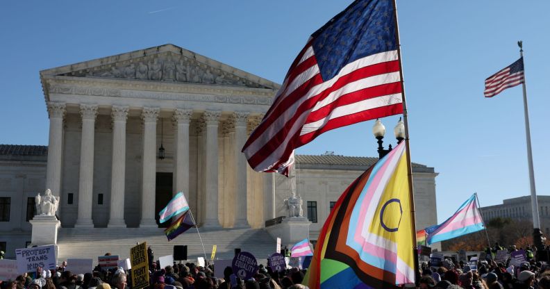 The American and Progress Pride flags outside of the Supreme Court.