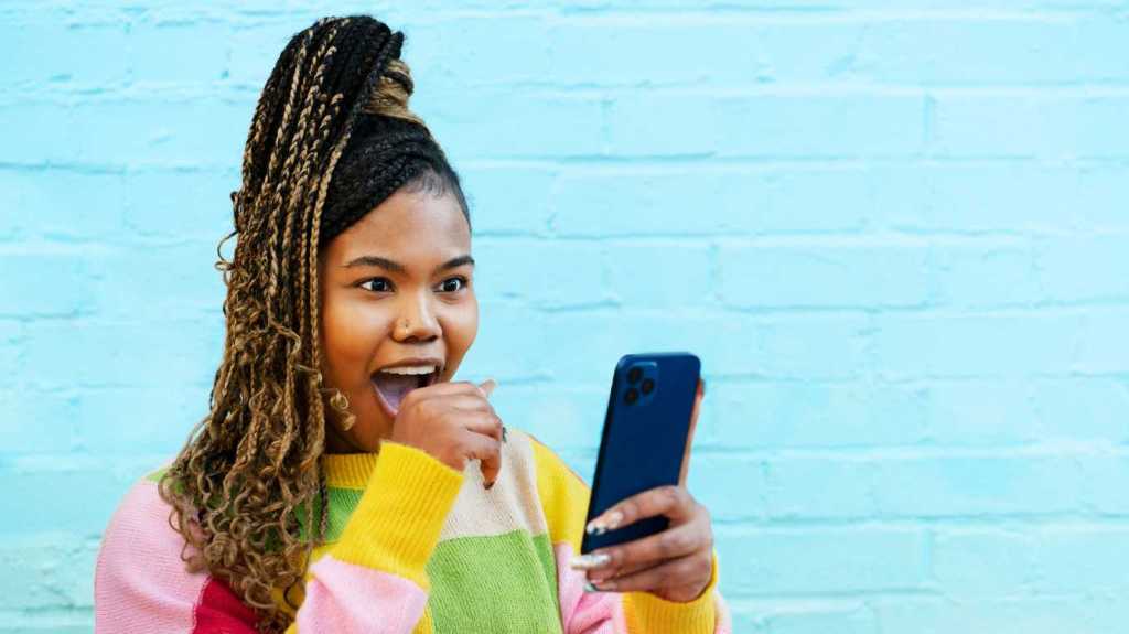 A woman responding to a smartphone
