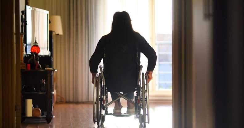 Wheelchair user on the move indoors.