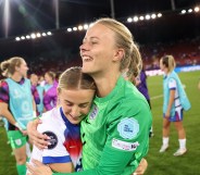 Hannah Hampton of England celebrates with team mate Chloe Kelly after the team's victory in the penalty shoot out and subsequent progression to the semi-final during the UEFA Women's EURO 2025 Quarter-Final match between Sweden and England