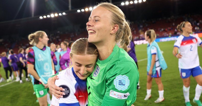 Hannah Hampton of England celebrates with team mate Chloe Kelly after the team's victory in the penalty shoot out and subsequent progression to the semi-final during the UEFA Women's EURO 2025 Quarter-Final match between Sweden and England