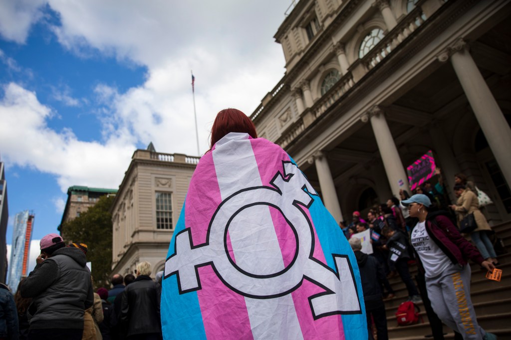 NEW YORK, NY - OCTOBER 24: L.G.B.T. activists and their supporters rally in support of transgender people on the steps of New York City Hall, October 24, 2018 in New York City. The group gathered to speak out against the Trump administration's stance toward transgender people. Last week, The New York Times reported on an unreleased administration memo that proposes a strict biological definition of gender based on a person's genitalia at birth. 