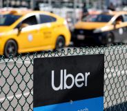 An image of two yellow taxi cabs with the uber logo in the foreground