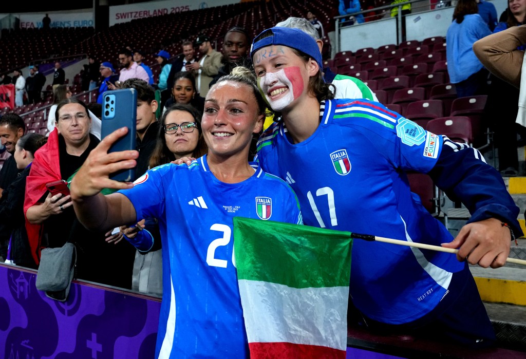 Giada Greggi of Italy poses for a selfie with a fan