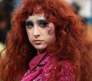 Chappell Roan poses at the 2025 Met Gala, wearing colourful make-up and a glittery pink top.