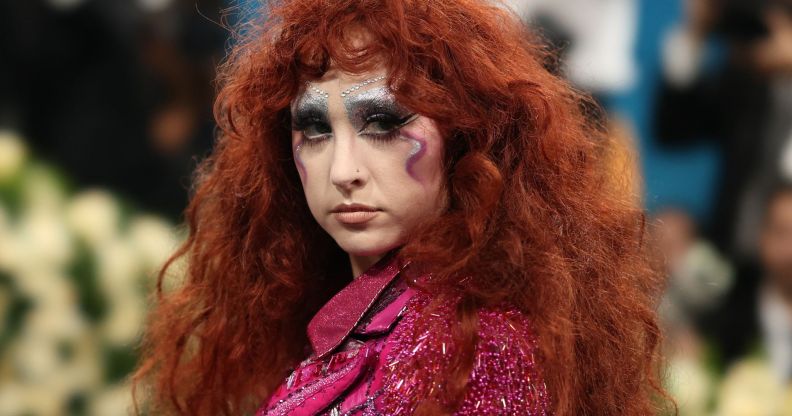 Chappell Roan poses at the 2025 Met Gala, wearing colourful make-up and a glittery pink top.