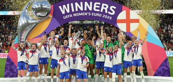 Leah Williamson and Keira Walsh of England lift the UEFA Women's EURO trophy after their team's victory in during the UEFA Women's EURO 2025 Final match between England and Spain