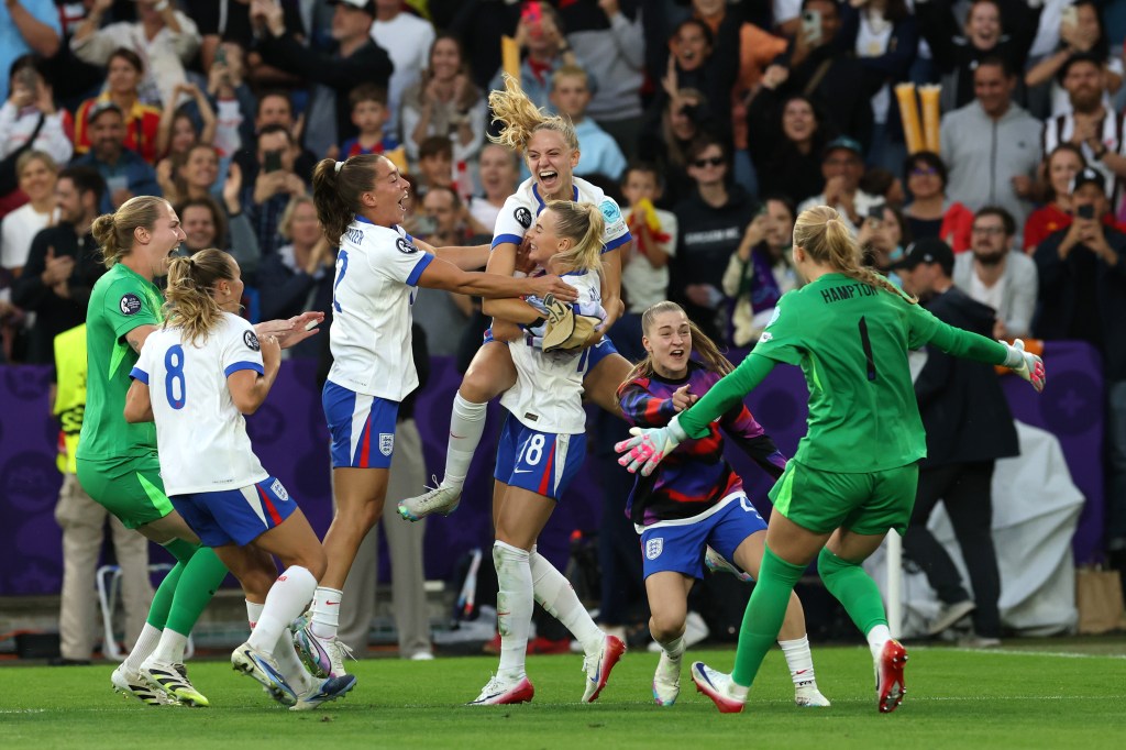 Chloe Kelly of England celebrates with teammates following the team's victory in the penalty shoot out during the UEFA Women's EURO 2025 Final match