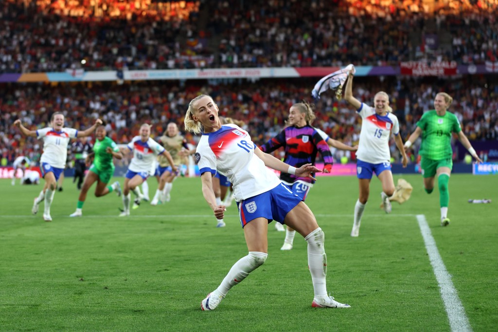 Chloe Kelly of England celebrates after scoring the team's winning penalty in the penalty shoot out during the UEFA Women's EURO 2025 Final match