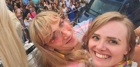 Two women smiling for a selfie.
