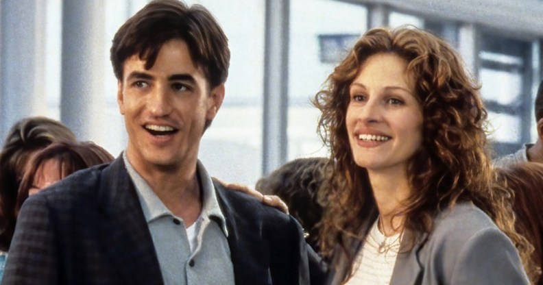 My Best Friend’s Wedding still: Jules (Julia Roberts) and Michael (Dermot Mulroney) smiling together in an airport.