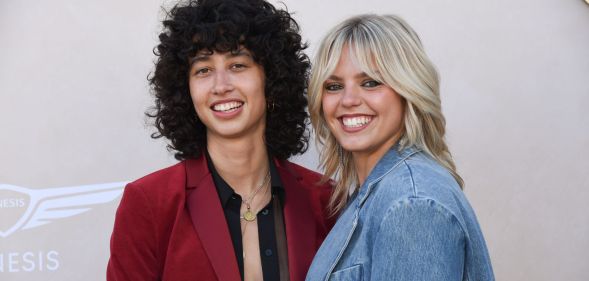 Musicians Reneé Rapp and Towa Bird pose together at a red carpet event