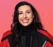 River Gallo smiles wearing a black and red jacket. They are superimposed onto an orange-pink background.