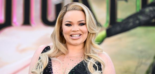 Trisha Paytas smiles on the red carpet at the Wicked premiere in 2024.