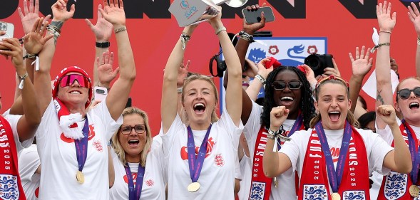 Leah Williamson of England lifts the UEFA Women's EURO trophy on stage during the England Women's team victory parade
