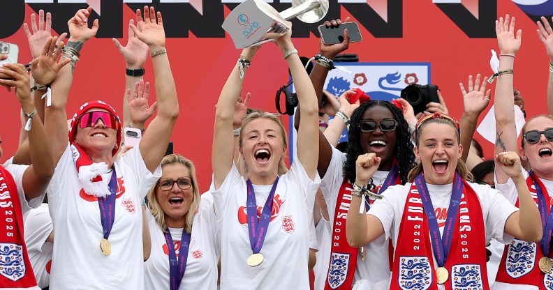 Leah Williamson of England lifts the UEFA Women's EURO trophy on stage during the England Women's team victory parade