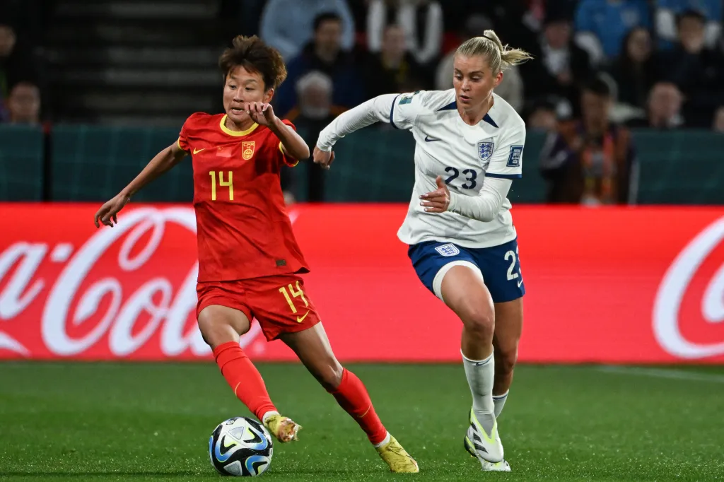England's forward Alessia Russo (R) and China's forward Lou Jiahui fight for the ball during the Australia and New Zealand 2023 Women's World Cup match