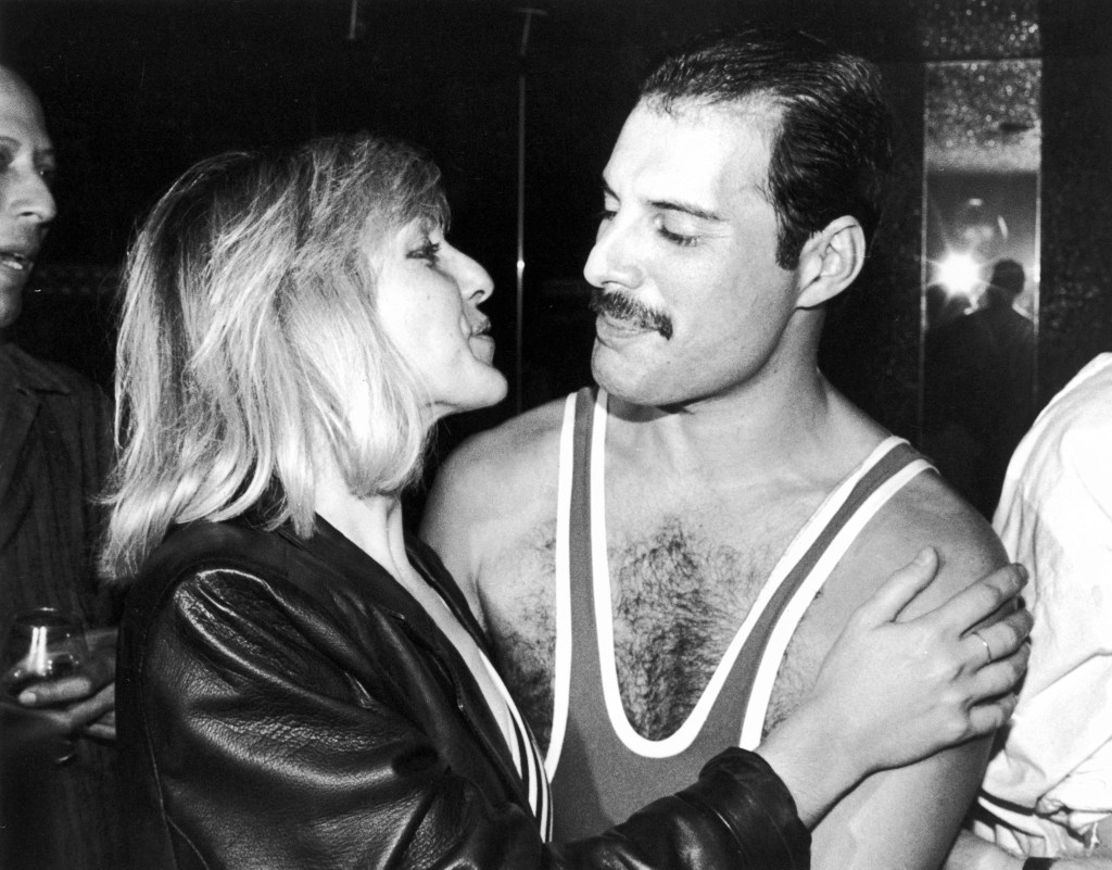 Black and white image of friends Mary Austin and Freddie Mercury.