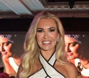 Christine McGuinness smiling in a white dress
