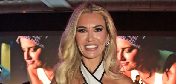 Christine McGuinness smiling in a white dress