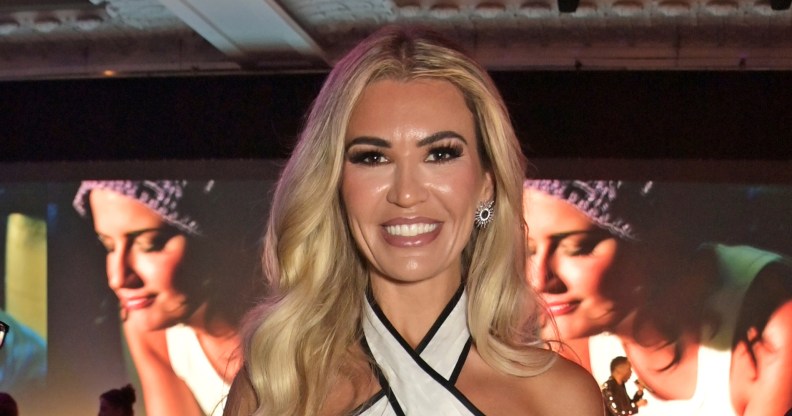 Christine McGuinness smiling in a white dress