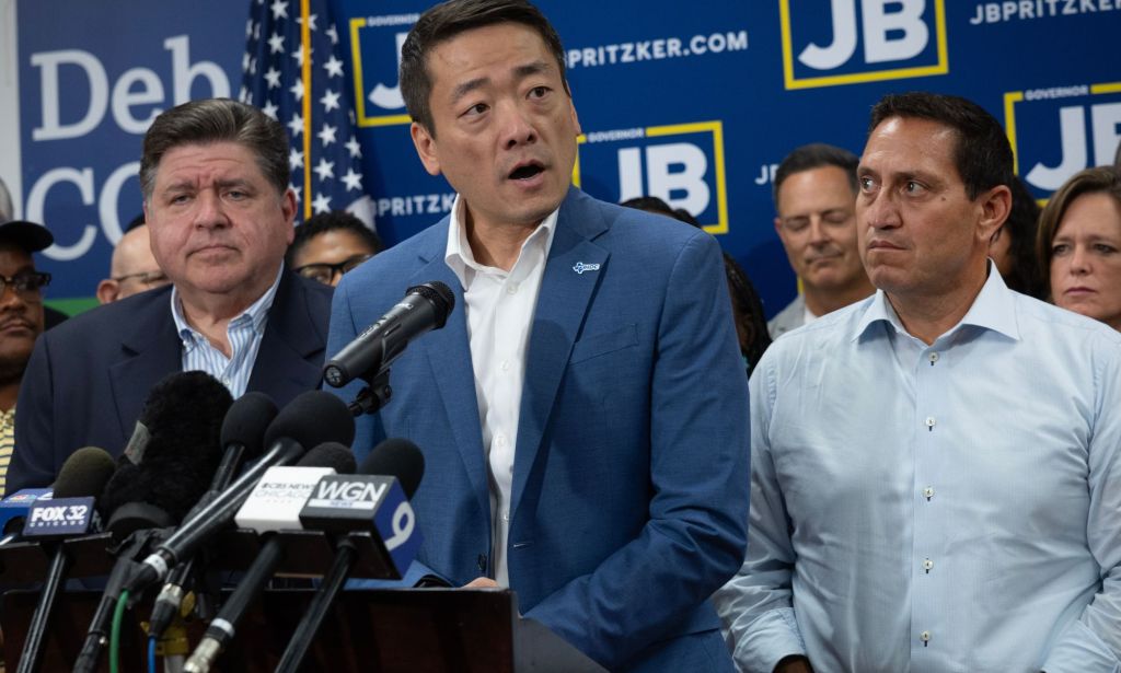 Gene Wu during a press conference, surrounded by Democrats.