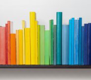 Multicoloured books on bookshelf.