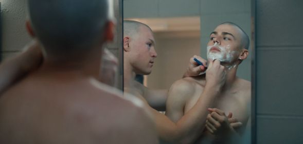 Miles Heizer shaves as a military recruit in Netflix show BOOTS.