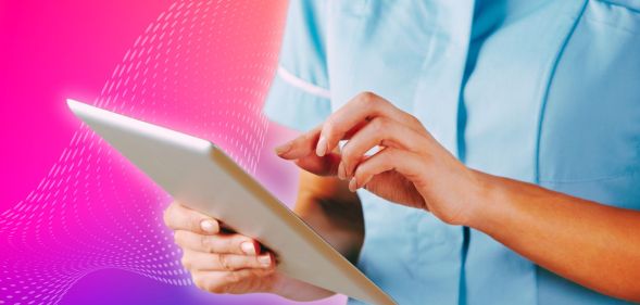 An NHS nurse on a tablet.