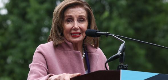Representative Nancy Pelosi speaks at a podium