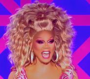 RuPaul laughs on the judging panel of Drag Race UK season two.