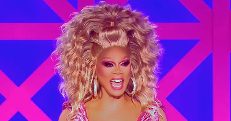 RuPaul laughs on the judging panel of Drag Race UK season two.
