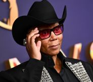 RuPaul stands on the red carpet