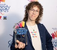 Sam Nicoresti smiles as she poses with the Edinburgh Fringe Best Comedy Show award.