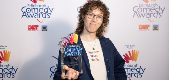 Sam Nicoresti smiles as she poses with the Edinburgh Fringe Best Comedy Show award.