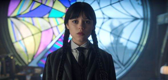 Jenna Ortega looks solemn and a little shocked in a still from Wednesday season two.