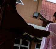 A man is seen receiving caning for violating sharia law in Lhokseumawe, on March 21, 2023, in Aceh Province.