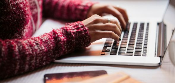 Someone typing on a keyboard.