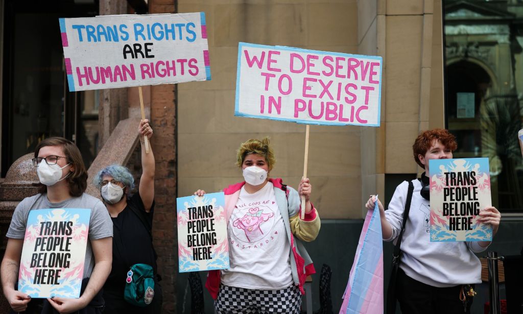 Activists holding signs during a protest.