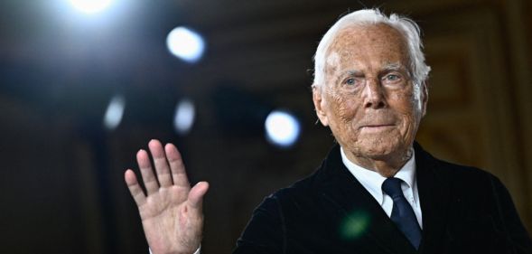 Italian designer Giorgio Armani acknowledges the applause at the end of his presentation for Armani Prive during the Women's Haute-Couture Spring/Summer 2025 Fashion Week to mark its 20th anniversary, in Paris on January 28, 2025. (Photo by JULIEN DE ROSA / AFP) (Photo by JULIEN DE ROSA/AFP via Getty Images)