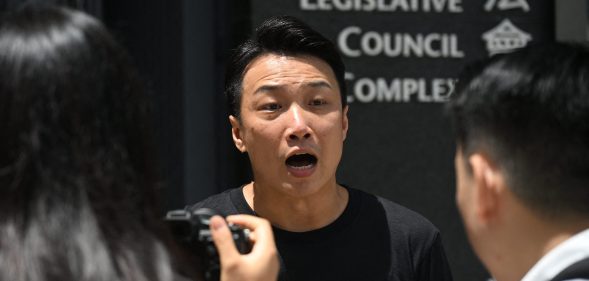 Hong Kong pro-democracy and LGBTQ rights activist Jimmy Sham speaks to reporters outside the Legislative Council Complex in Hong Kong on September 10, 2025. Hong Kong lawmakers are expected to vote September 10 on whether to grant limited rights to same-sex couples, as fears grow in the LGBTQ community that even this narrow equality bid could be sunk by conservative pro-Beijing voices.